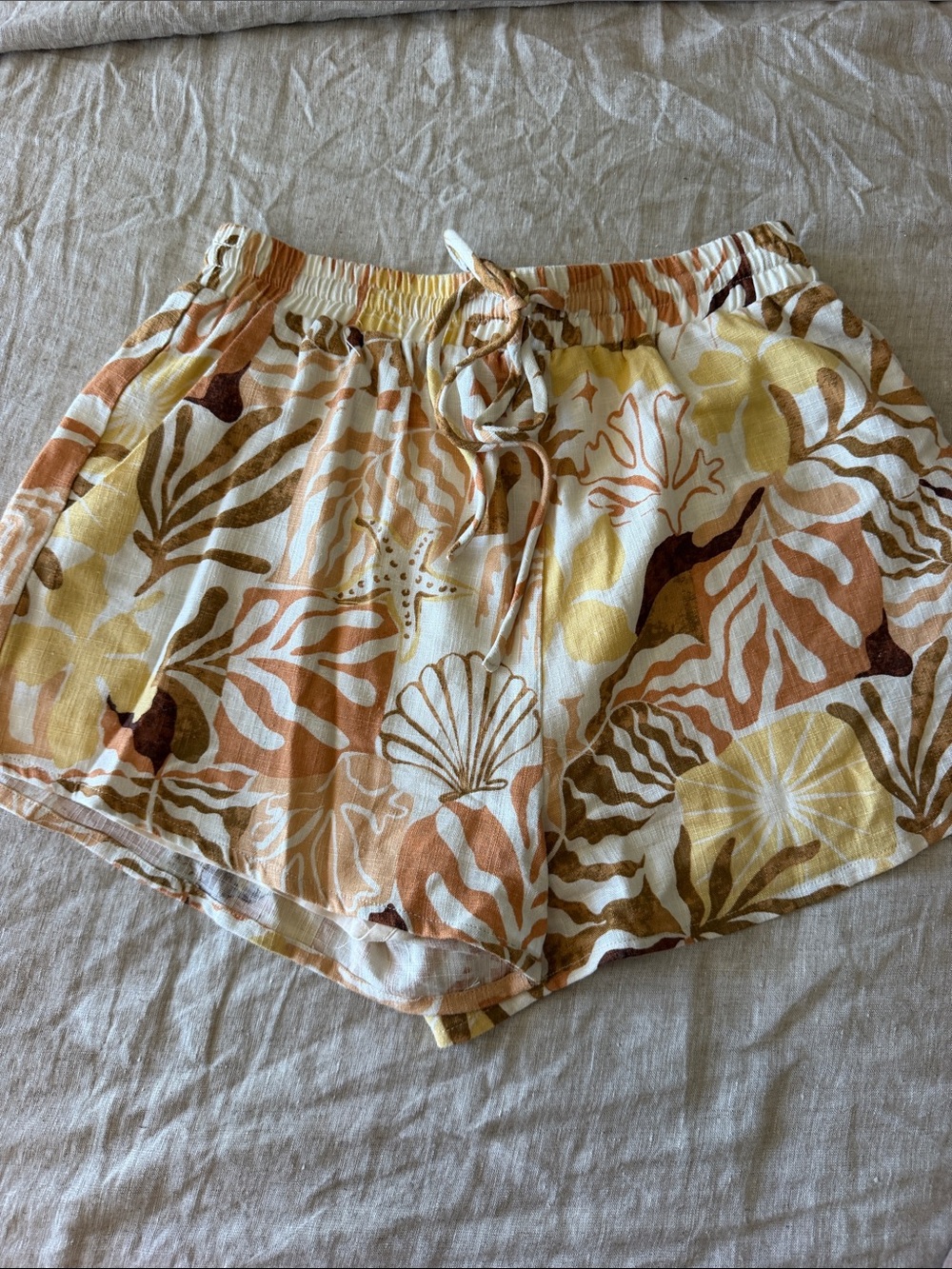 mahina Shell & Foliage Drawstring linen Shorts in Cream, Brown & Yellow